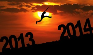 Amazing silhouette of man jumping at sunset toward 2014